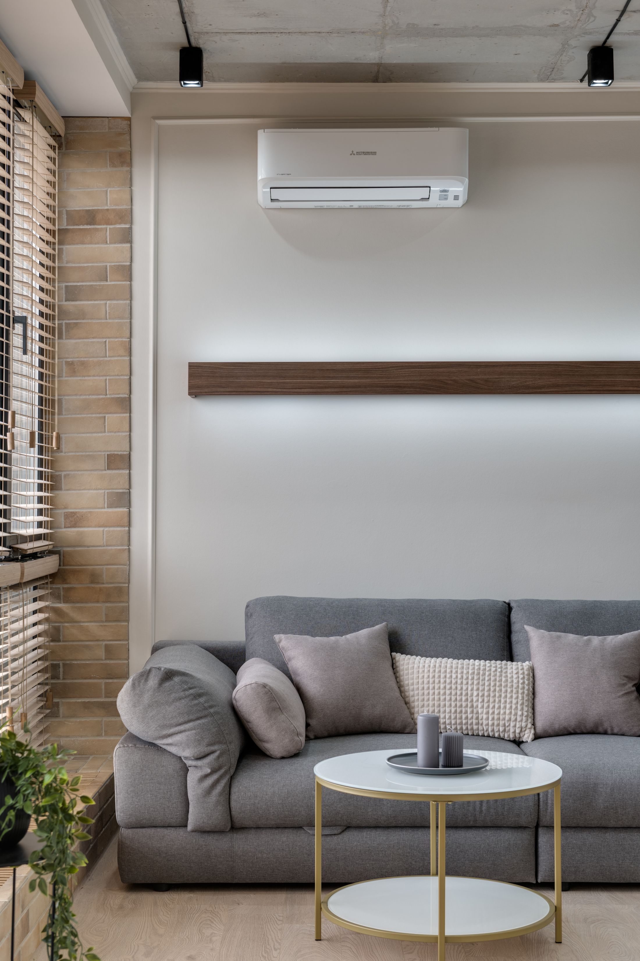 Luxury living room with a discreet wall mounted air conditioning unit